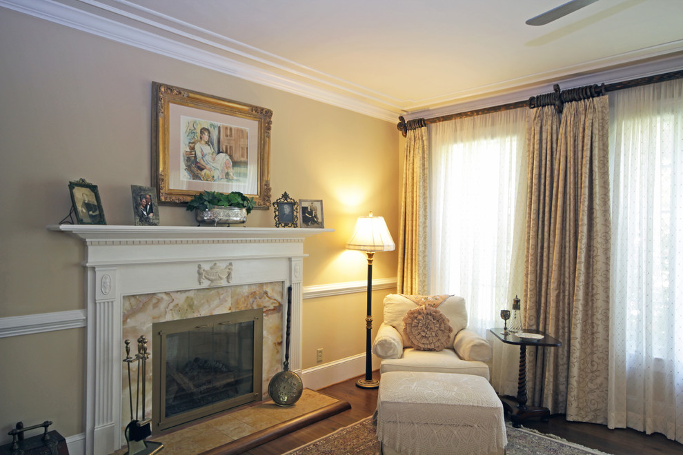 This is an example of a large traditional master bedroom in Richmond with a standard fireplace and a stone fireplace surround.