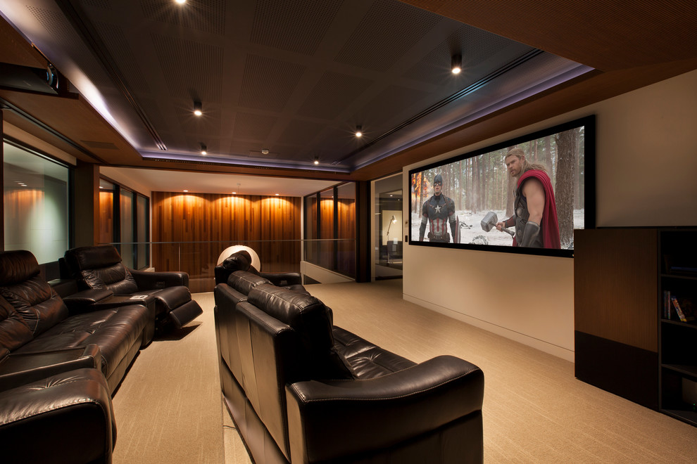 Design ideas for a contemporary home theatre in Melbourne with carpet and a projector screen.