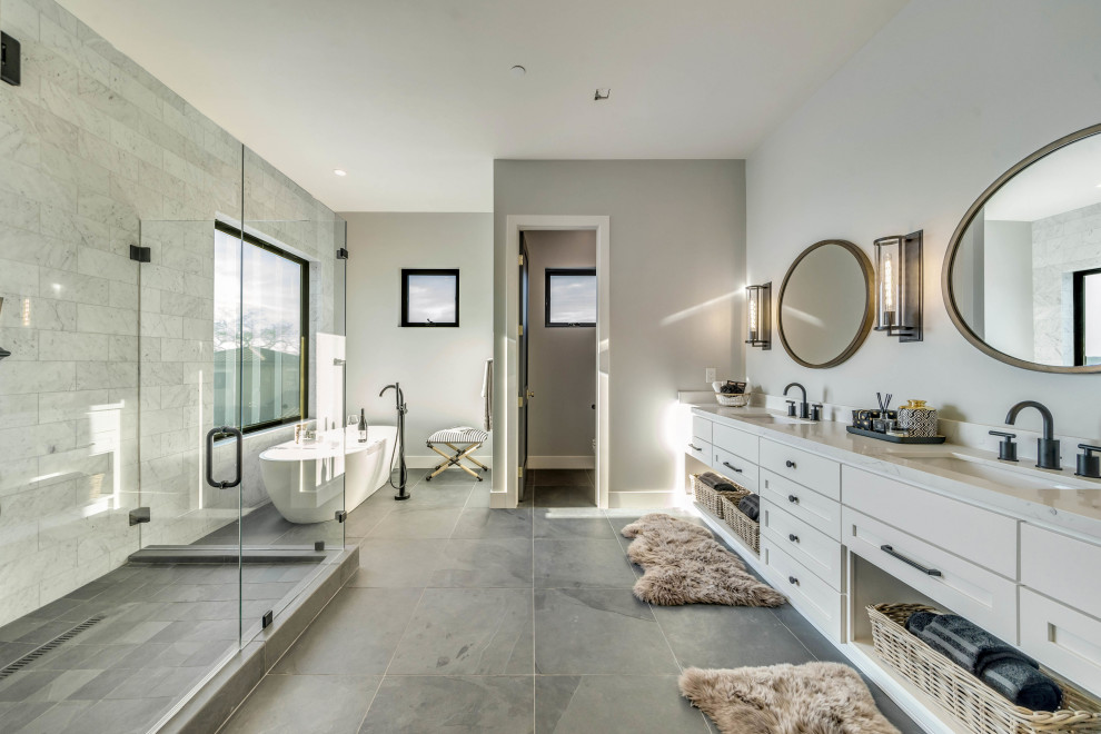 Design ideas for a transitional bathroom in San Francisco with shaker cabinets, white cabinets, a freestanding tub, a corner shower, gray tile, grey walls, an undermount sink, grey floor, white benchtops, a double vanity and a built-in vanity.