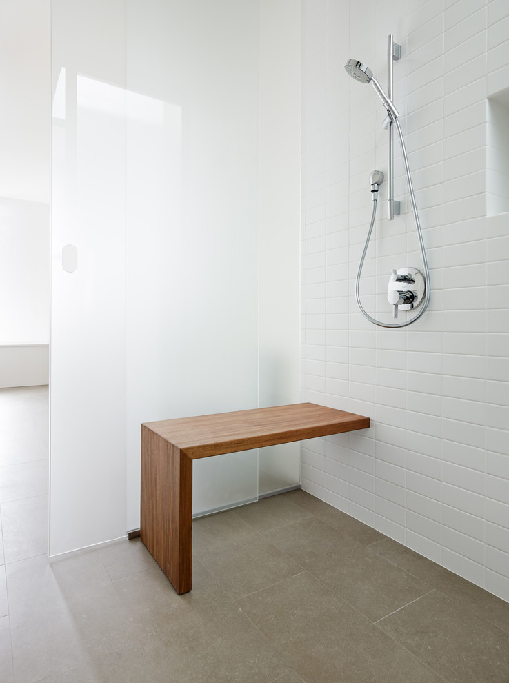 This is an example of a modern bathroom in San Francisco with a sliding shower screen.