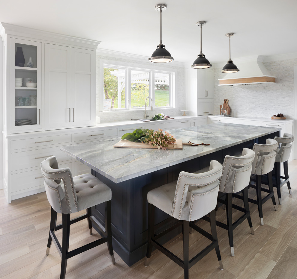 Mid-sized transitional u-shaped porcelain tile and beige floor eat-in kitchen photo in Bridgeport with an undermount sink, shaker cabinets, white cabinets, quartzite countertops, white backsplash, mosaic tile backsplash, stainless steel appliances, an island and multicolored countertops