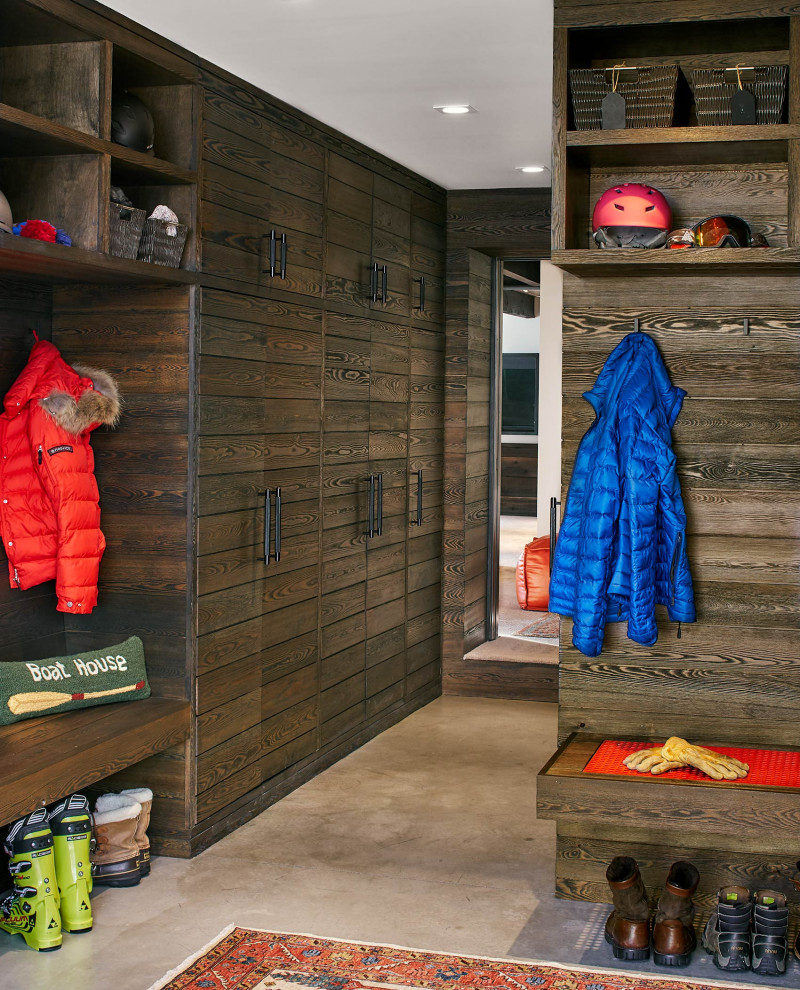 Photo of a country mudroom in Denver with concrete floors and grey floor.