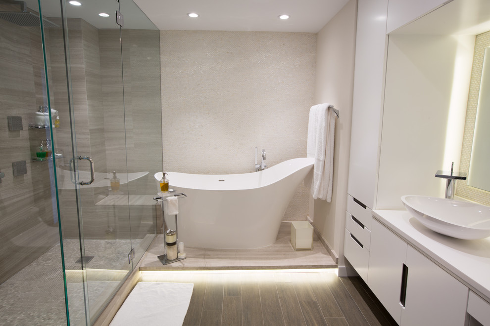 Design ideas for a large modern master bathroom in Miami with a japanese tub, a corner shower, a one-piece toilet, white tile, mosaic tile, white walls, porcelain floors, grey floor and a hinged shower door.