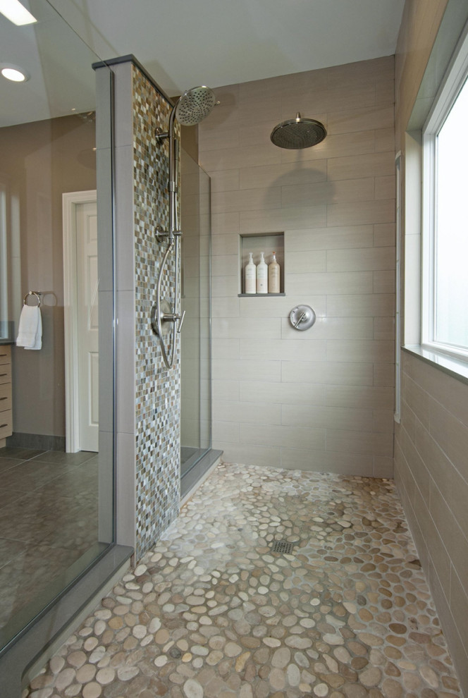 Bathroom - mid-sized eclectic master beige tile and porcelain tile porcelain tile, gray floor and double-sink bathroom idea in Columbus with flat-panel cabinets, light wood cabinets, beige walls, an undermount sink, quartz countertops, gray countertops, a niche and a built-in vanity