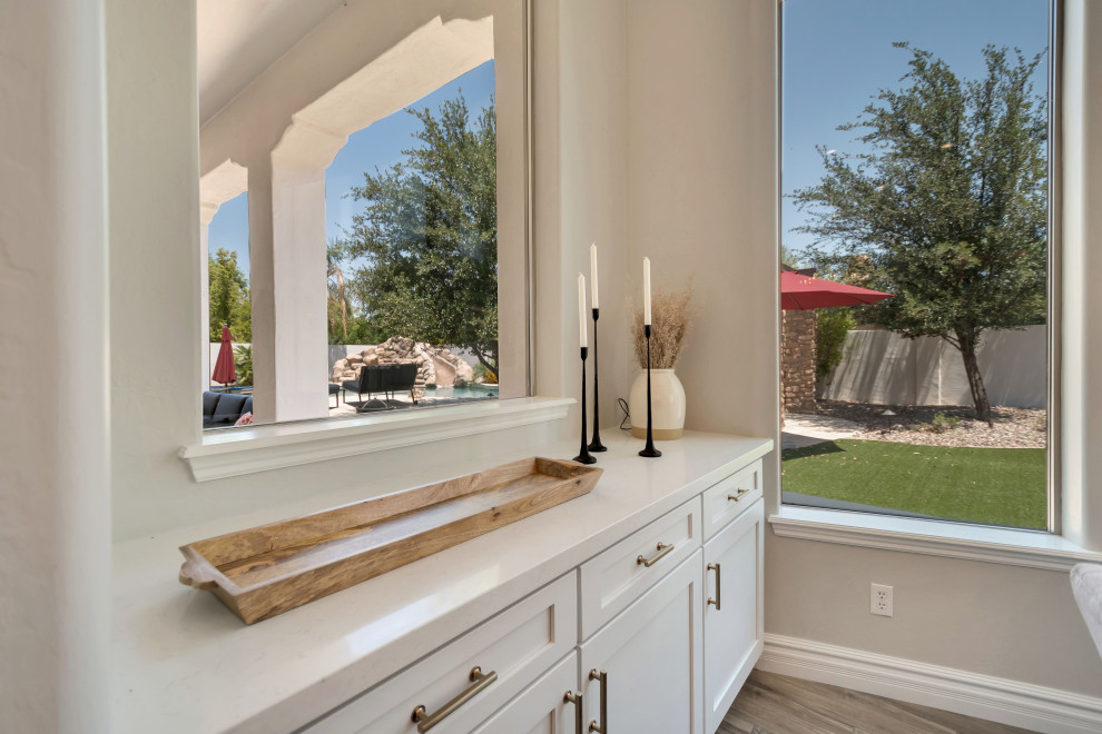 Example of a large transitional home design design in Phoenix