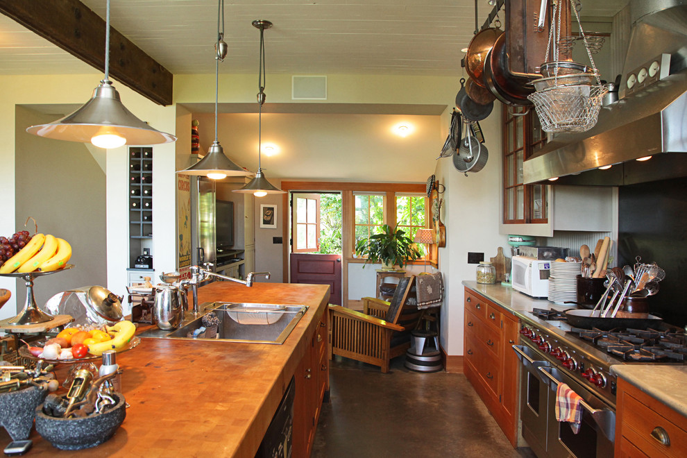 Photo of an eclectic single-wall open plan kitchen in Seattle with with island.
