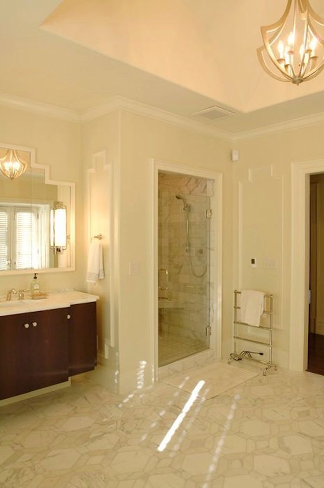 Design ideas for a modern master bathroom in Raleigh with flat-panel cabinets, dark wood cabinets, a freestanding tub, a corner shower, white walls and a hinged shower door.