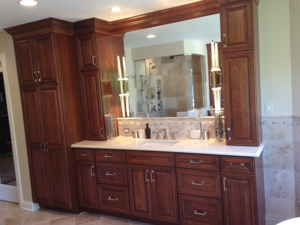 Freestanding bathtub - large transitional master beige tile and stone tile freestanding bathtub idea in Chicago with raised-panel cabinets, medium tone wood cabinets and quartz countertops