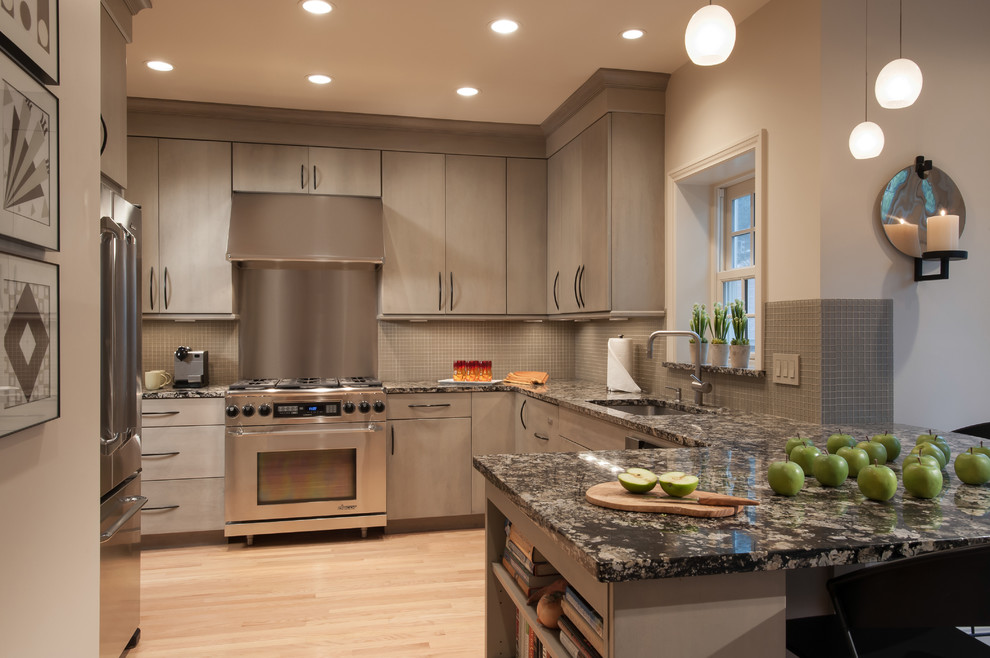 Inspiration for a transitional kitchen in St Louis with an undermount sink, flat-panel cabinets, grey cabinets, grey splashback, stainless steel appliances and light hardwood floors.