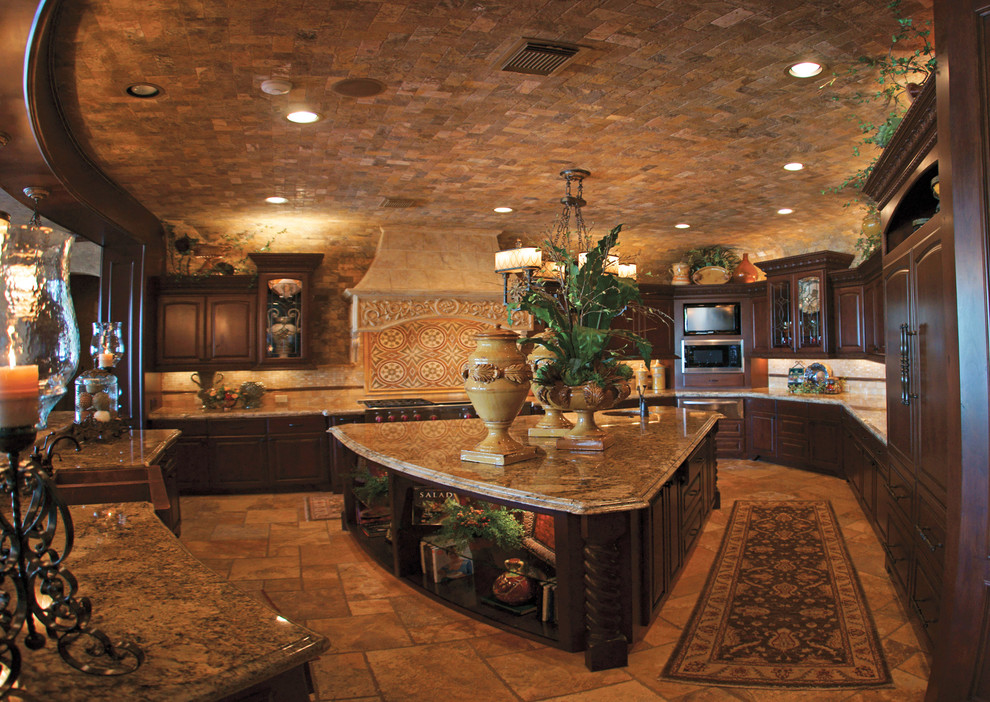 Inspiration for an eat-in kitchen remodel in Houston with a farmhouse sink, recessed-panel cabinets, dark wood cabinets, granite countertops, beige backsplash, custom tile backsplash and paneled appliances
