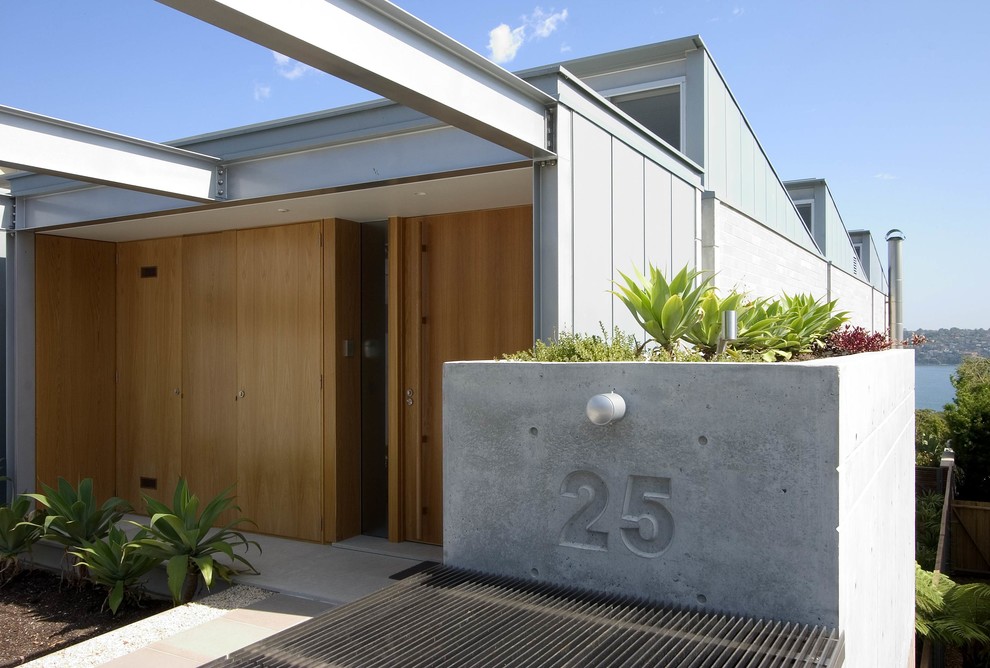This is an example of a modern exterior in Sydney with wood siding.