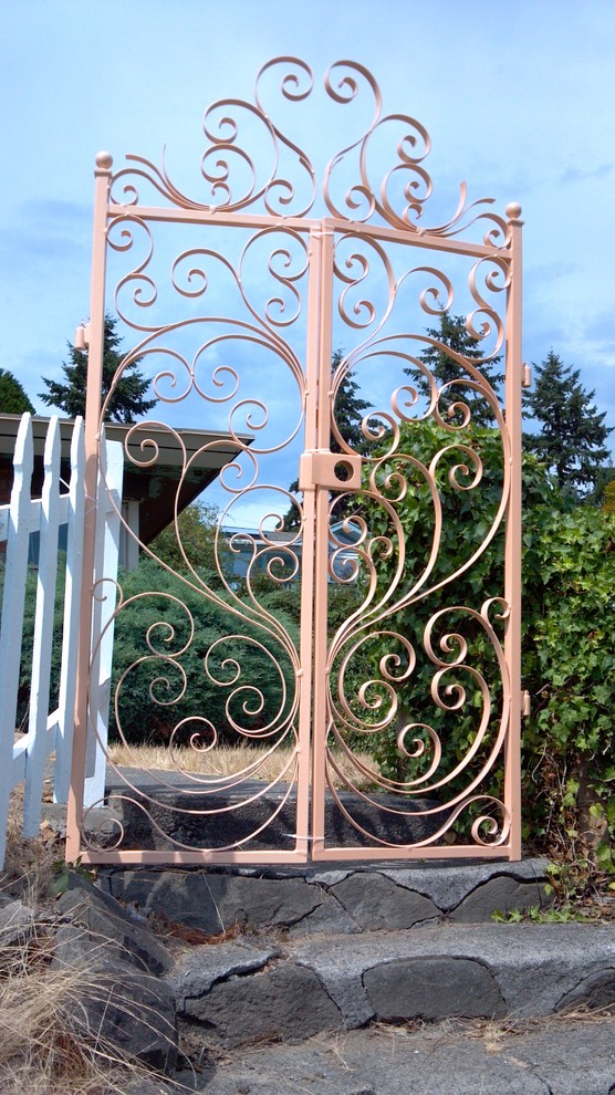 Inspiration for a large victorian brick floor front door remodel in Seattle with metallic walls and a blue front door