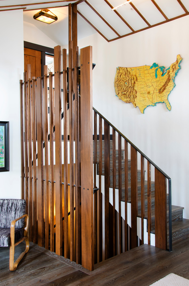 Photo of a contemporary wood u-shaped staircase in Denver with wood risers.