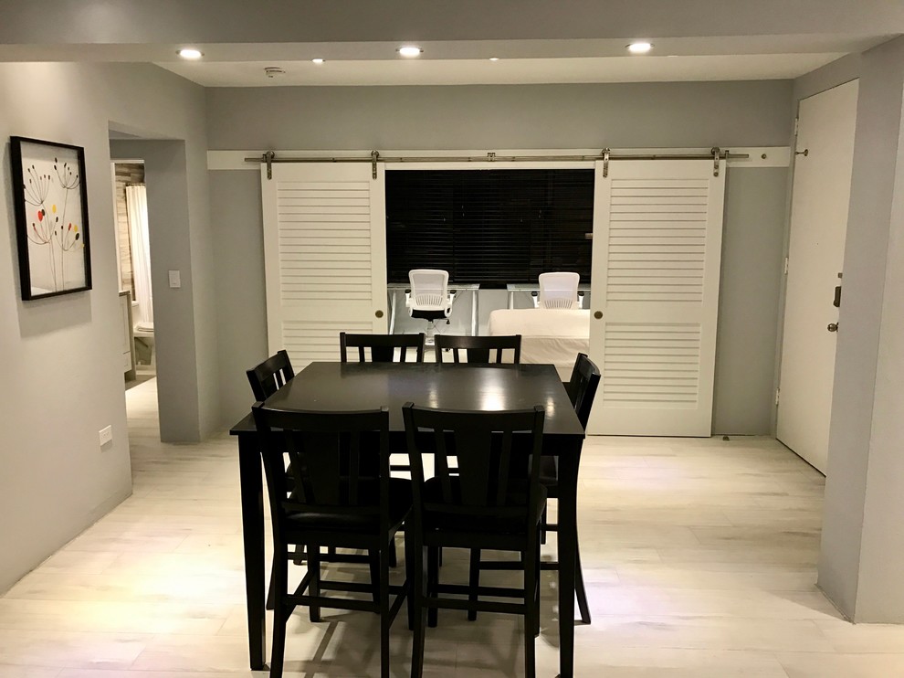 Example of a transitional dining room design in Miami