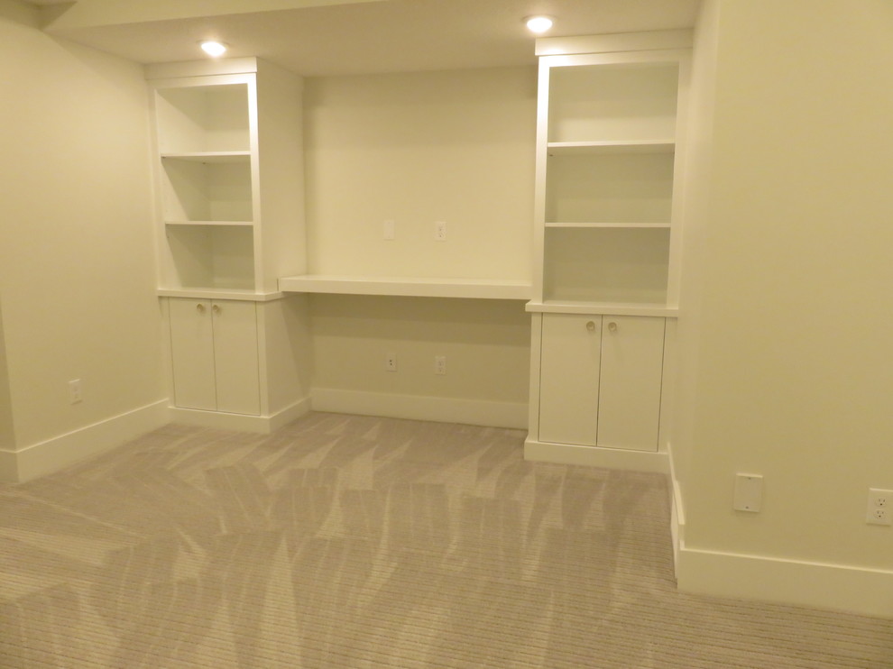 Basement - mid-sized transitional look-out carpeted and gray floor basement idea in Calgary with white walls