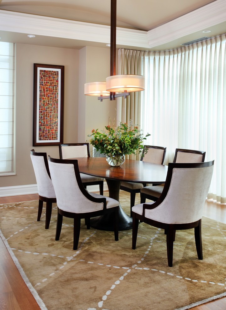 This is an example of a transitional separate dining room in Chicago with beige walls and no fireplace.