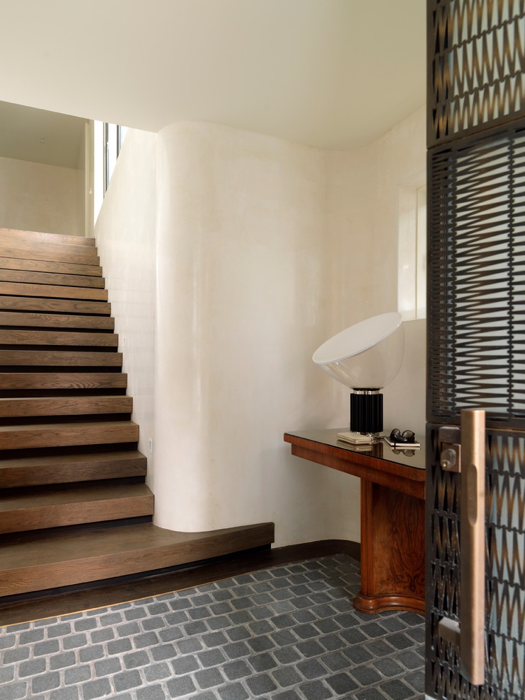Inspiration for a mid-sized transitional wood u-shaped staircase in Sydney with wood risers.