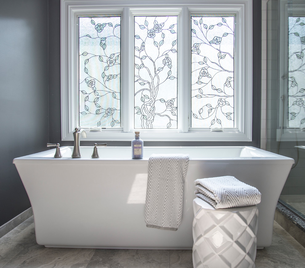 Mid-sized transitional master gray tile and subway tile porcelain tile freestanding bathtub photo in Chicago with flat-panel cabinets, white cabinets, a two-piece toilet, gray walls, an undermount sink and granite countertops