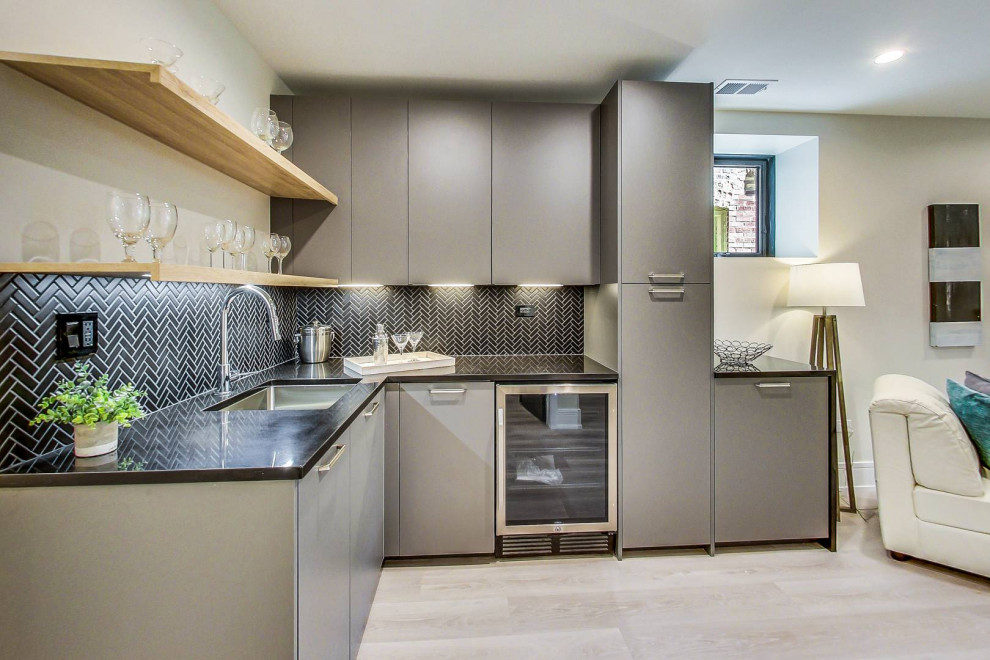 Sleek Grey Wet Bar With Herringbone Backsplash