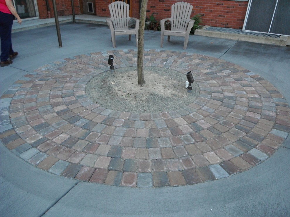 Inspiration for a mid-sized transitional patio in Seattle with brick pavers.