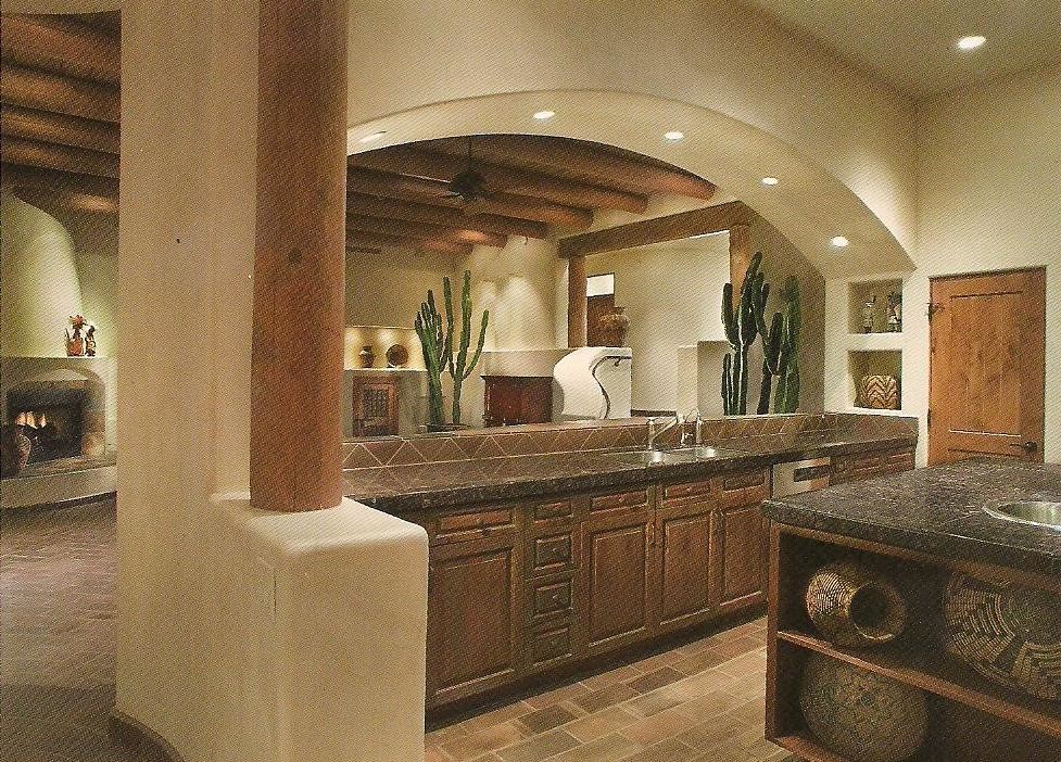 This is an example of a mid-sized contemporary u-shaped open plan kitchen in Phoenix with an undermount sink, raised-panel cabinets, medium wood cabinets, granite benchtops, metallic splashback, stone tile splashback, stainless steel appliances, terra-cotta floors and with island.