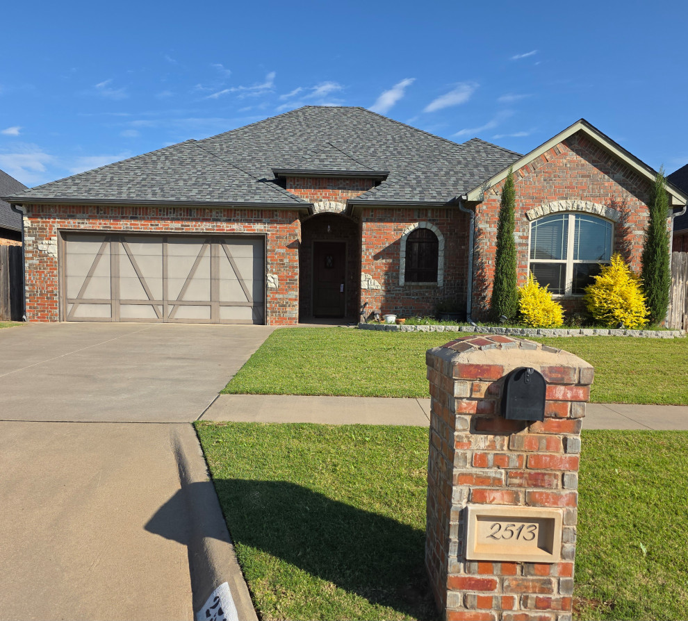 Arched stone windows with brick exterior
