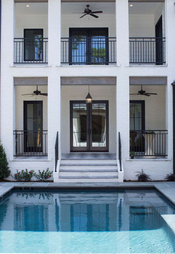 Inspiration for a large country backyard rectangular and tile pool remodel in Houston