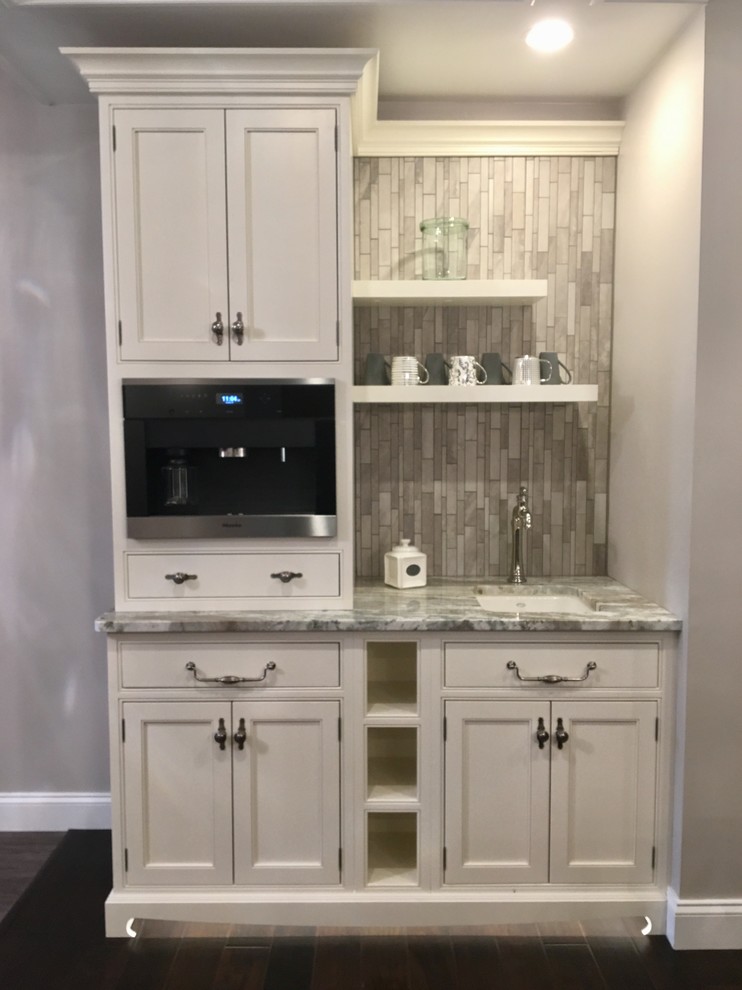 Inspiration for a small traditional single-wall separate kitchen in Philadelphia with an undermount sink, recessed-panel cabinets, white cabinets, quartzite benchtops, grey splashback, porcelain splashback, stainless steel appliances, dark hardwood floors, no island and brown floor.