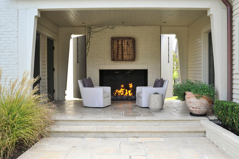 Photo of a mid-sized contemporary side yard patio in Houston with a fire feature, concrete pavers and a roof extension.