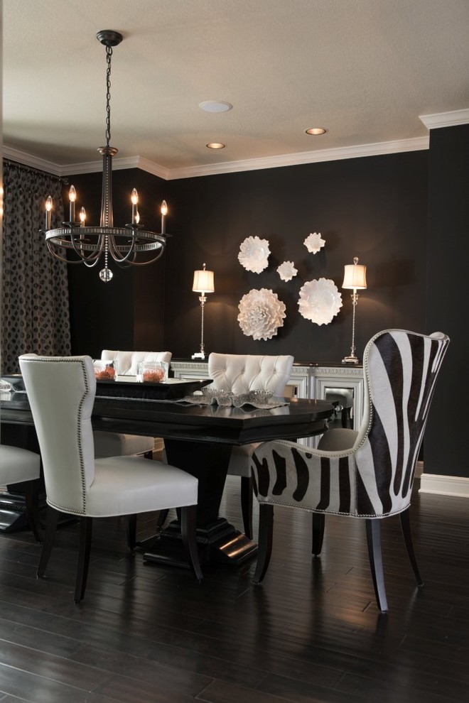 Inspiration for a mid-sized modern separate dining room in Kansas City with black walls, dark hardwood floors, no fireplace and black floor.