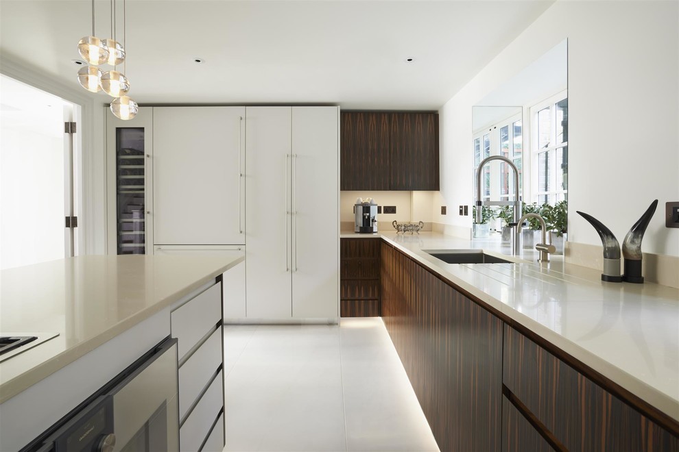 Photo of a contemporary kitchen in London with beige benchtop.
