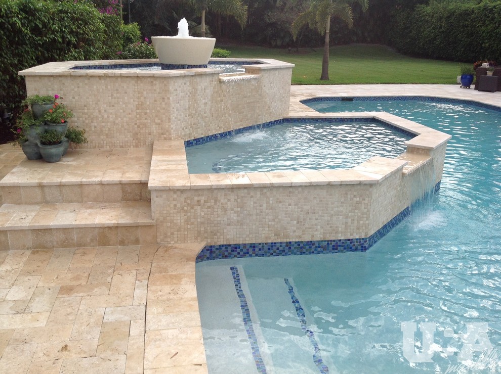Design ideas for a large country aboveground pool in Miami with natural stone pavers.