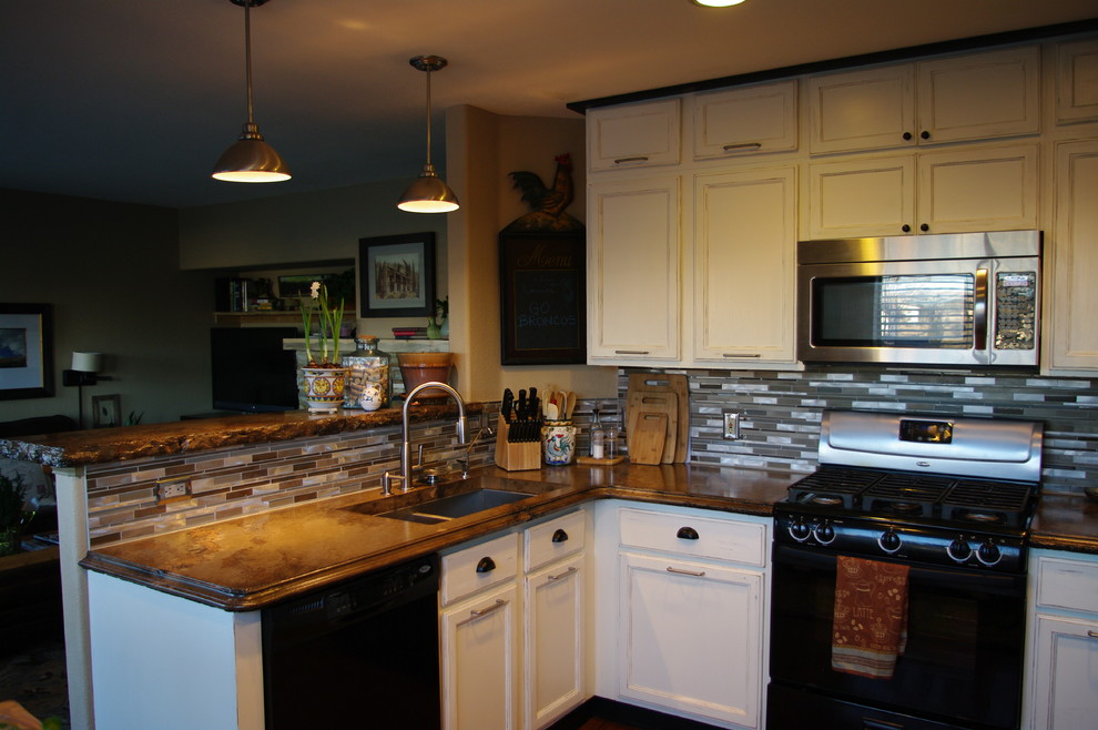 Mountain style eat-in kitchen photo in Denver with white cabinets and concrete countertops