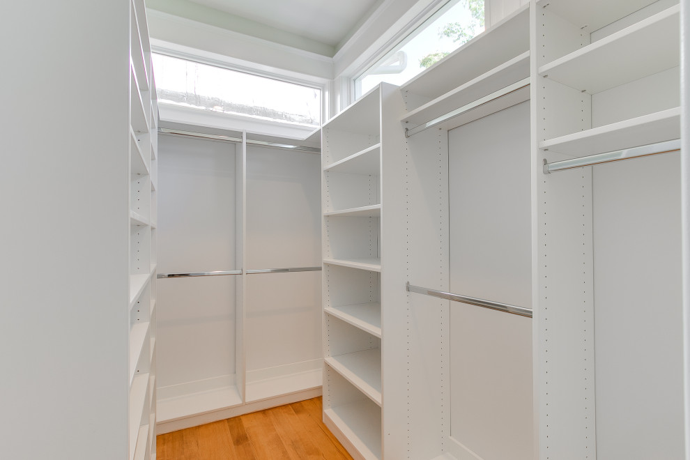 This is an example of a large traditional storage and wardrobe in Richmond.