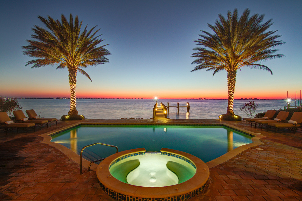 Design ideas for a mediterranean custom-shaped pool in Tampa.