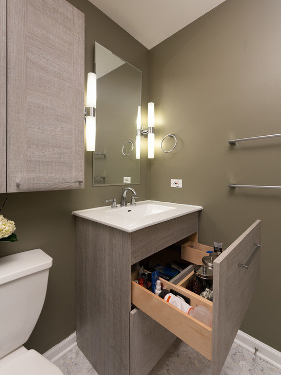 Inspiration for a mid-sized transitional 3/4 bathroom in Chicago with flat-panel cabinets, medium wood cabinets, an alcove shower, a two-piece toilet, gray tile, stone slab, beige walls, mosaic tile floors, an integrated sink and marble benchtops.