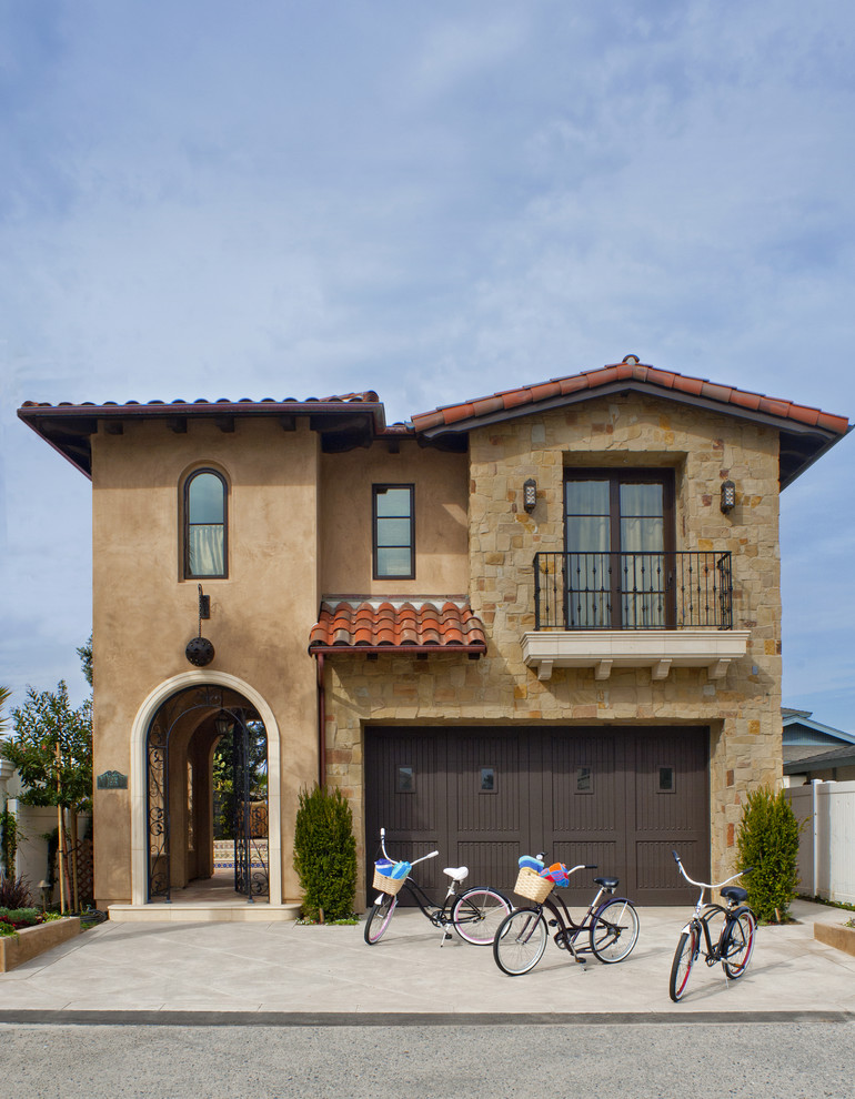 Photo of a mediterranean two-storey brown exterior in Los Angeles.