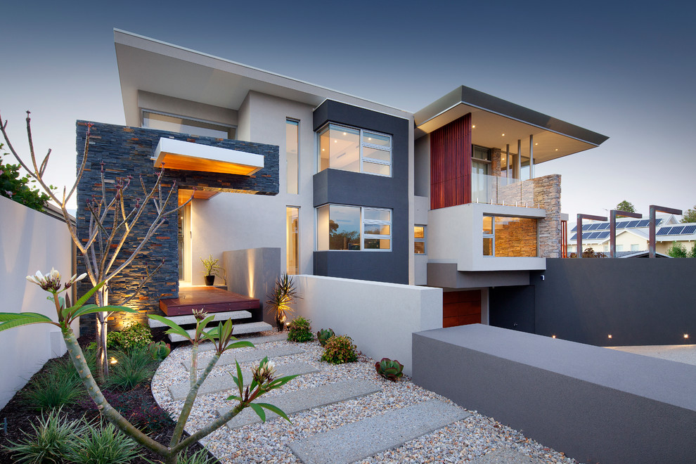 Inspiration for a contemporary two-storey grey exterior in Perth with stone veneer and a flat roof.