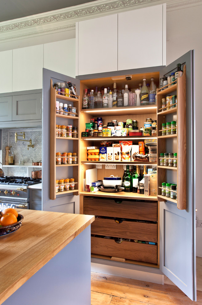 Design ideas for a transitional kitchen pantry in London.