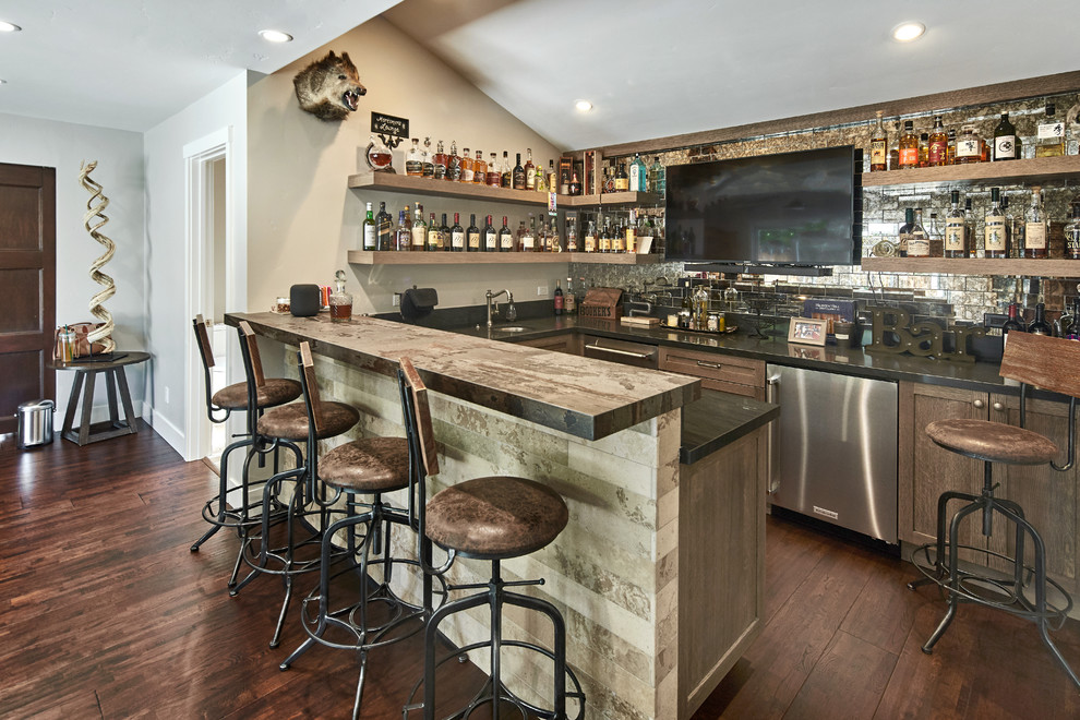 Photo of a large contemporary u-shaped seated home bar in San Francisco with an undermount sink, shaker cabinets, distressed cabinets, quartz benchtops, multi-coloured splashback, glass tile splashback, dark hardwood floors, brown floor and brown benchtop.