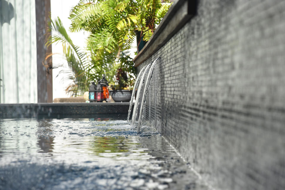Pool fountain - large backyard rectangular aboveground pool fountain idea with decking