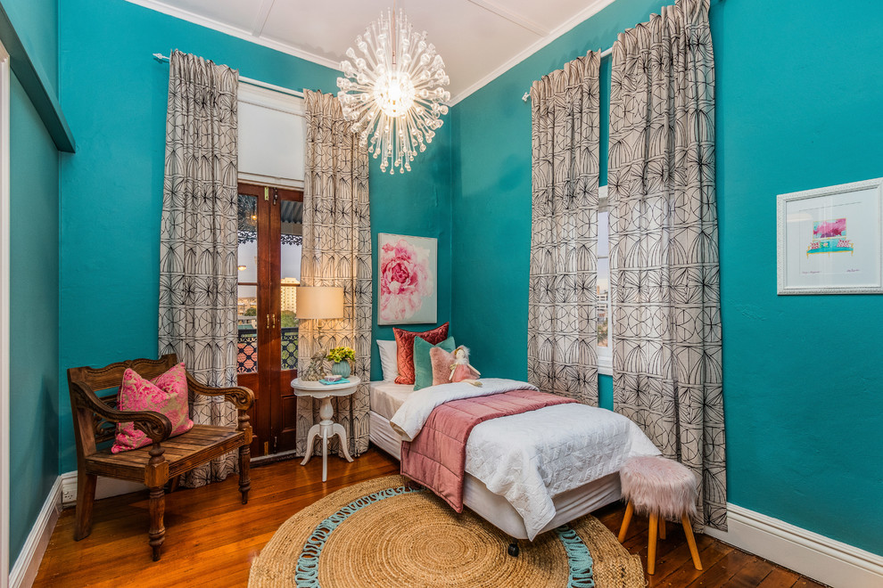 Inspiration for a transitional kids' bedroom for kids 4-10 years old and girls in Brisbane with green walls, medium hardwood floors and brown floor.
