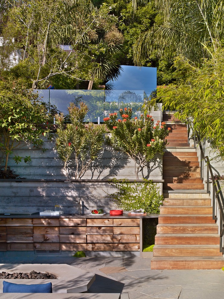 Example of a trendy backyard patio kitchen design in San Francisco with no cover