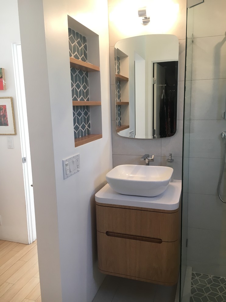 Design ideas for a small contemporary master bathroom in Santa Barbara with light wood cabinets, a corner shower, white tile, porcelain tile, white walls, porcelain floors, a vessel sink, quartzite benchtops, white floor, a hinged shower door and flat-panel cabinets.