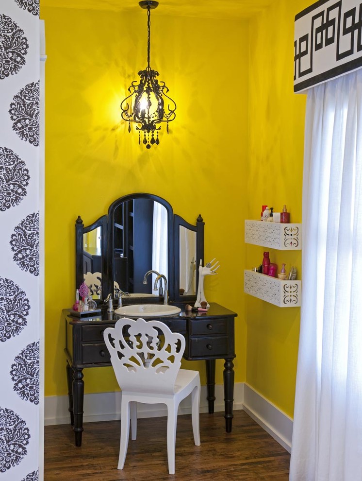 Eclectic kids' room in San Diego with yellow walls and medium hardwood floors for girls.