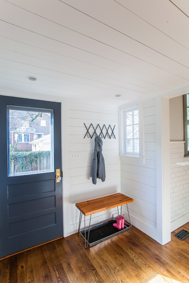 Mid-sized transitional entryway in DC Metro with white walls and dark hardwood floors.