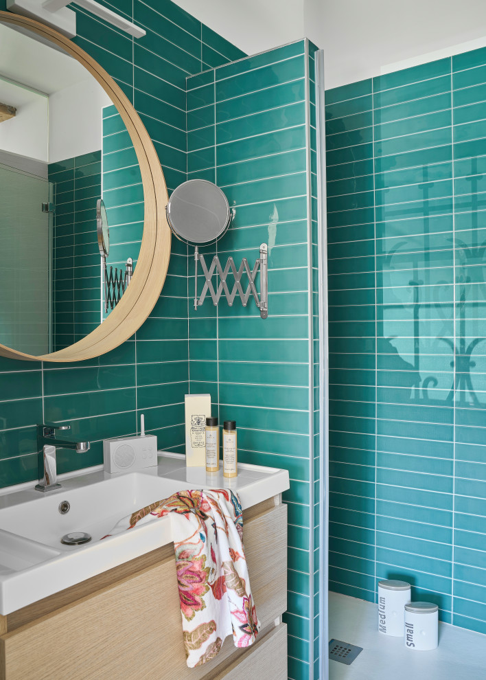 This is an example of a small classic bathroom in Other with freestanding cabinets, white cabinets, green tiles, green walls, laminate floors, a wall-mounted sink, a hinged door, white worktops, a built-in shower, a shower bench, a single sink, a floating vanity unit and porcelain tiles.