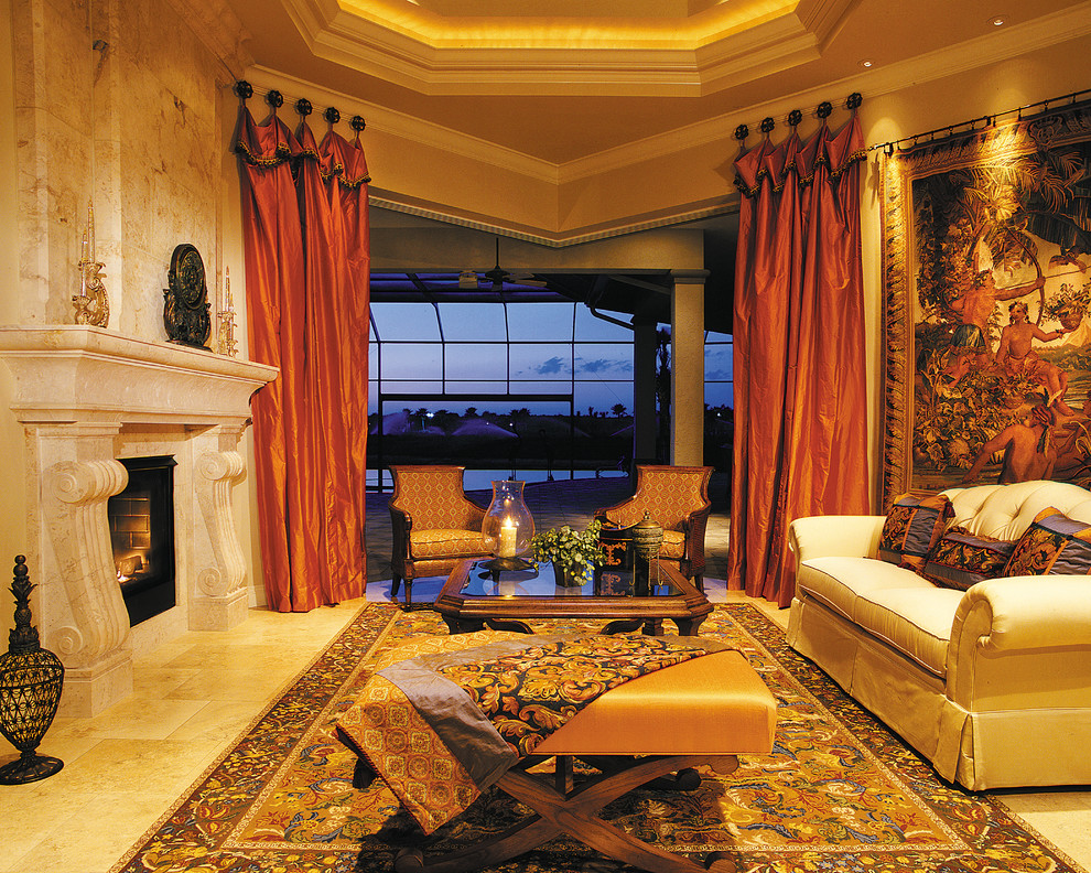 This is an example of an expansive traditional formal enclosed living room in Miami with beige walls, travertine floors, a standard fireplace, a stone fireplace surround and no tv.