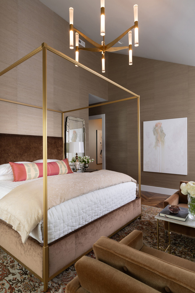 Bedroom - large transitional master medium tone wood floor, brown floor, vaulted ceiling and wallpaper bedroom idea in Other with brown walls, a standard fireplace and a stone fireplace