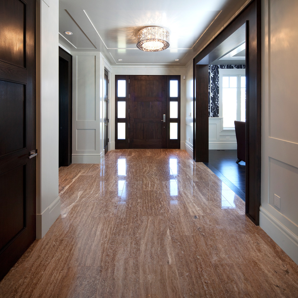 This is an example of a traditional entryway in Calgary with marble floors.